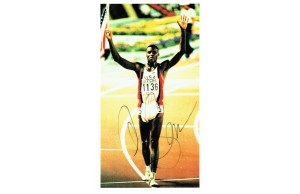 Carl Lewis Signed A4 Sheet of The Olympic Champion 