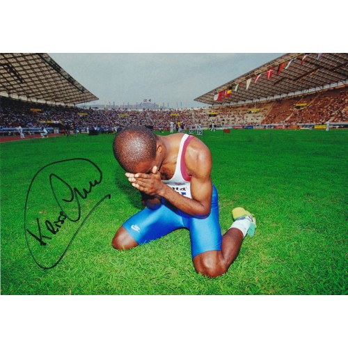 Kris Akabusi signed 12x8 Team GB Athletics Photo